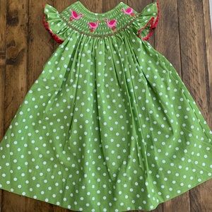 Angel Bishop dress with Flamingo embroidery.